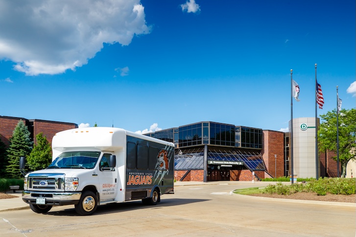 Shuttle bus parked in front of the Governors State University entrance Shuttle bus parked in front of the Governors State University entrance